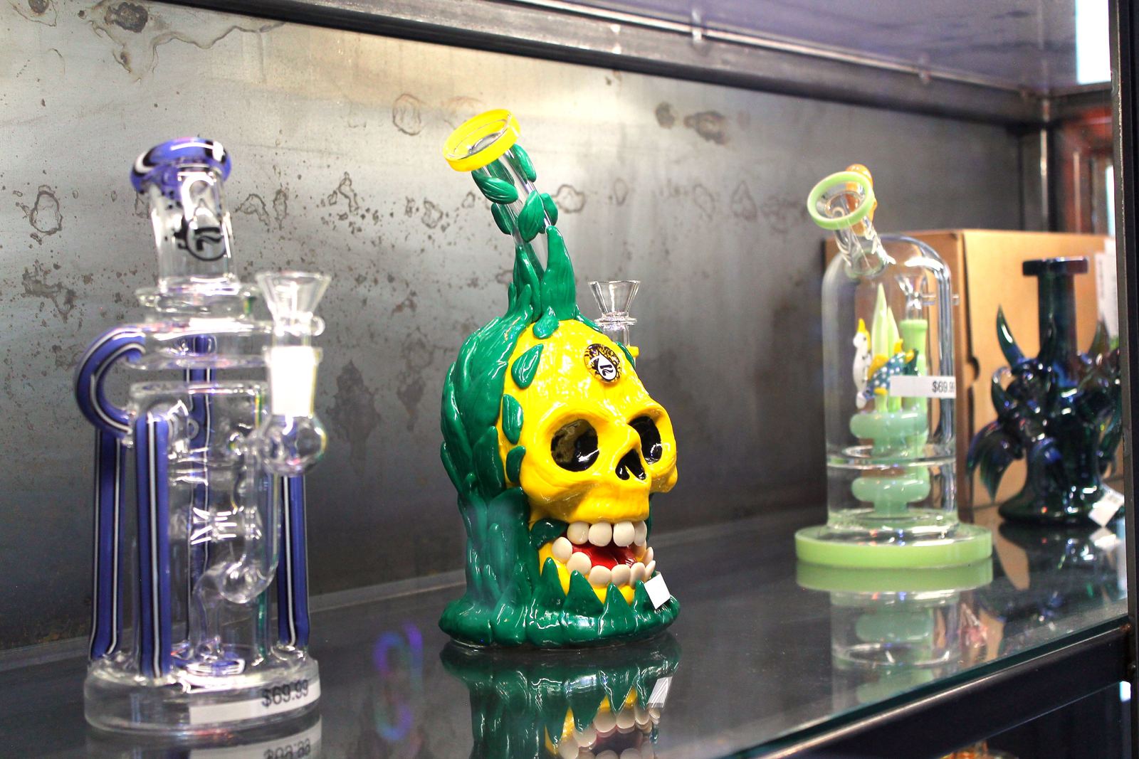 Glass pieces on a lit shelf